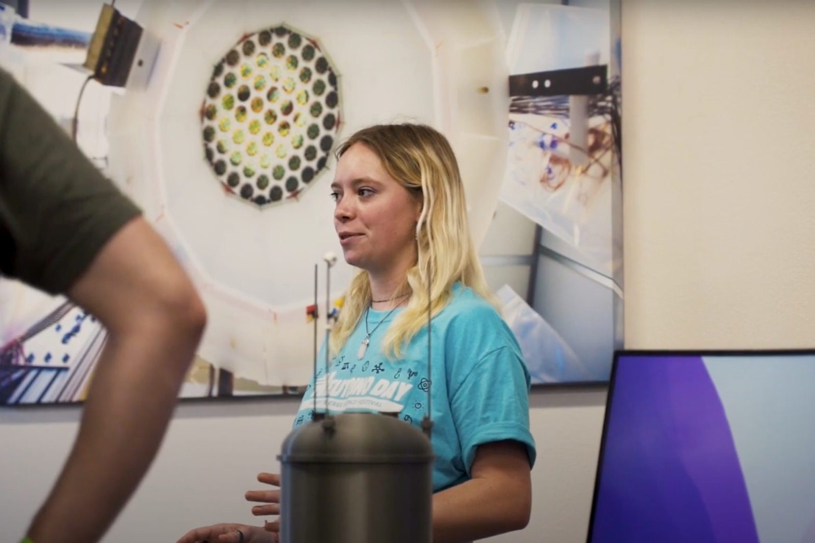 Visitors meet with presenters at Neutrino Day