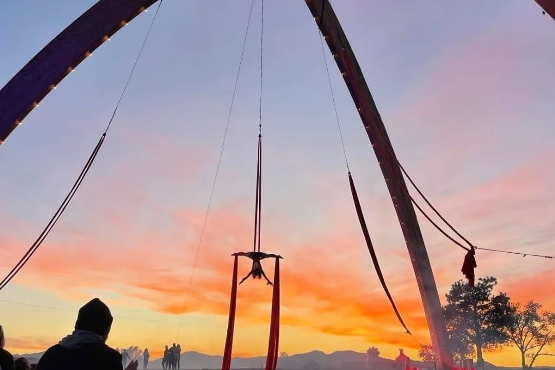 Aerialist performs at sunset